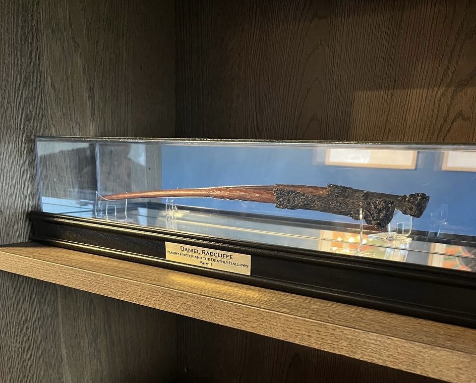 Screen‑used wand in office display case